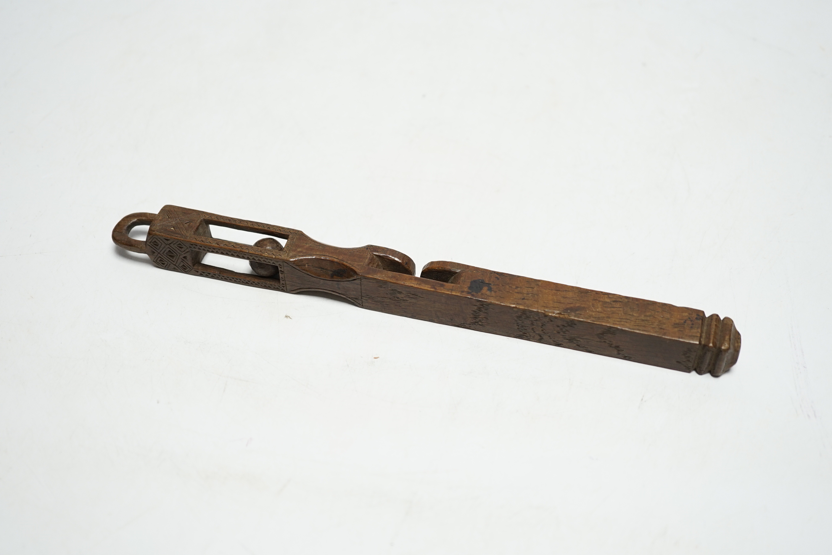An 18th century carved wood love token, probably Welsh, 21.5cm